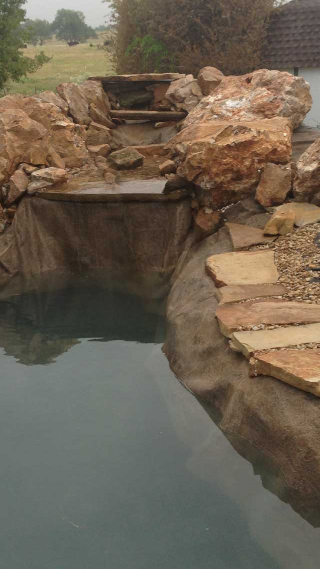 Installing a preformed pond - the pond has been dug in