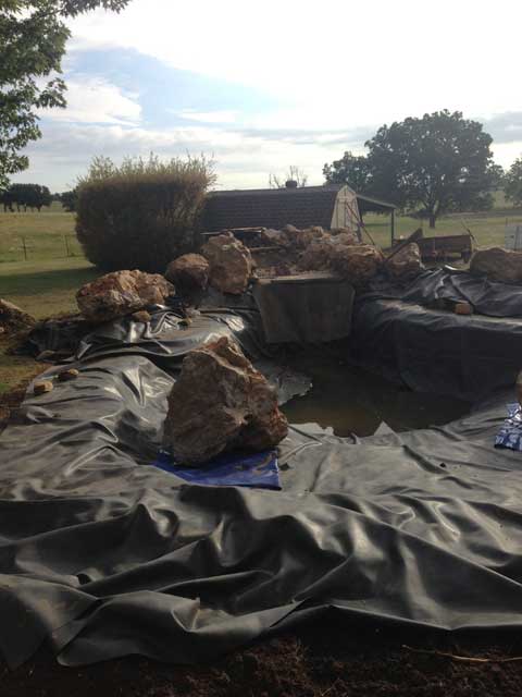 Installing a preformed pond - before